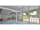 Enclosed patio showcasing plenty of natural light, ceiling fans, and seating area with outdoor view at 346 Tanager Ct, Lakeland, FL 33803