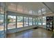Enclosed patio with tile flooring and abundant windows offers views of the pool area at 346 Tanager Ct, Lakeland, FL 33803