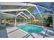The screened-in pool is surrounded by greenery, offering a private and serene escape at 346 Tanager Ct, Lakeland, FL 33803