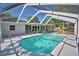 A screened-in pool offers a refreshing escape, complemented by a clean, bright patio and the surrounding greenery at 346 Tanager Ct, Lakeland, FL 33803