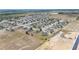 Expansive aerial view showcasing a well-planned residential community with neatly arranged homes and spacious surroundings at 3560 Spring Creek Rd, Dundee, FL 33838