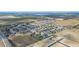 Expansive aerial view showcasing a well-planned residential community with neatly arranged homes and spacious surroundings at 3560 Spring Creek Rd, Dundee, FL 33838