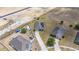 Aerial view of the property with solar panels surrounded by landscaped lawns at 3560 Spring Creek Rd, Dundee, FL 33838