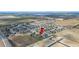 Expansive aerial view showcasing a well-planned residential community with neatly arranged homes and spacious surroundings at 3560 Spring Creek Rd, Dundee, FL 33838
