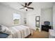 Bright bedroom features closet and ceiling fan at 3560 Spring Creek Rd, Dundee, FL 33838