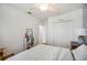 Bedroom with closet, end table and view of another room at 3560 Spring Creek Rd, Dundee, FL 33838