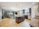 A kitchen featuring an island, stainless steel appliances, and dark wood cabinets blending style and functionality at 3560 Spring Creek Rd, Dundee, FL 33838