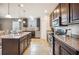 Bright kitchen featuring granite countertops, stainless steel appliances, and an island with bar seating at 3560 Spring Creek Rd, Dundee, FL 33838