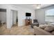 Comfortable living room with tile floors and a view into the bathroom at 3560 Spring Creek Rd, Dundee, FL 33838