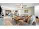 Living room view showcasing seamless flow from kitchen to the dining area creating an inviting space at 3560 Spring Creek Rd, Dundee, FL 33838