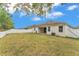 Spacious backyard features a covered patio with ample space and white fence at 3592 Prescott Loop, Lakeland, FL 33810