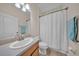 Simple bathroom featuring a single vanity, tile floors, and a shower with a curtain at 3592 Prescott Loop, Lakeland, FL 33810