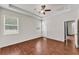 Spacious bedroom featuring wood floors, a ceiling fan, recessed lighting, and two windows at 3592 Prescott Loop, Lakeland, FL 33810