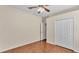 Bright bedroom with a ceiling fan and light wood-look flooring at 3592 Prescott Loop, Lakeland, FL 33810