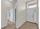 Bright foyer with tile flooring, high ceilings, and a view to an adjacent bathroom at 3592 Prescott Loop, Lakeland, FL 33810