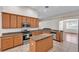 Lovely kitchen with stone countertops, stainless appliances and center island at 3592 Prescott Loop, Lakeland, FL 33810