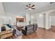 Bright, open-concept living room with hardwood floors and seamless flow to the kitchen area at 3592 Prescott Loop, Lakeland, FL 33810