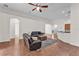 Open concept living area featuring hardwood floors and a breakfast bar overlooking the kitchen at 3592 Prescott Loop, Lakeland, FL 33810