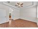 Sunlit main bedroom with hardwood floors, tray ceilings and ensuite bath access at 3592 Prescott Loop, Lakeland, FL 33810