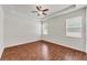 Large main bedroom features a ceiling fan, tray ceilings, and plenty of natural light at 3592 Prescott Loop, Lakeland, FL 33810