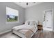 Cozy bedroom with natural light, wood floors, and ensuite bath at 3664 Frentress Dr, Lakeland, FL 33812