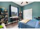 bedroom with built in desk and bookshelves next to a window with curtains at 3664 Frentress Dr, Lakeland, FL 33812