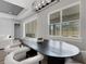 Dining room with modern light fixture, black dining table and backyard view at 3664 Frentress Dr, Lakeland, FL 33812