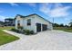 This home has a two-car garage and a beautifully manicured lawn and garden at 3664 Frentress Dr, Lakeland, FL 33812