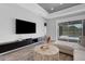 Bright living room with view of the pool and covered outdoor seating area at 3664 Frentress Dr, Lakeland, FL 33812