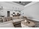 Open-concept living room and kitchen area with modern lighting fixtures at 3664 Frentress Dr, Lakeland, FL 33812