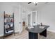 Bright office space with double doors, stylish black desk, and a view of the home's interior at 3664 Frentress Dr, Lakeland, FL 33812