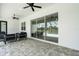 Covered patio with ceiling fans and tiled flooring, perfect for outdoor relaxation and entertaining at 3664 Frentress Dr, Lakeland, FL 33812