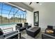 Screened patio featuring modern outdoor furniture, a fire pit, and view of the pool at 3664 Frentress Dr, Lakeland, FL 33812