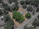 Wide aerial shot of a large lot with mature trees and a single Gathering home at 3705 Garland St, Mulberry, FL 33860