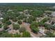 Aerial view of property highlighting its location surrounded by mature trees in a tranquil neighborhood setting at 3705 Garland St, Mulberry, FL 33860
