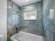 Beautiful bathroom featuring an elegant tiled shower and tub at 3705 Garland St, Mulberry, FL 33860