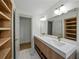 Bright bathroom featuring a double vanity with a quartz countertop, gold hardware, and stylish marble tile flooring at 3705 Garland St, Mulberry, FL 33860