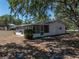 Exterior view of the home, including the screened in lanai on the rear of the home at 3705 Garland St, Mulberry, FL 33860