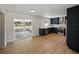 Modern kitchen features stainless steel appliances, dark blue cabinets, and an open floor plan at 3705 Garland St, Mulberry, FL 33860