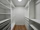 Organized walk-in closet with custom shelving, drawers and hanging space, providing ample storage at 3705 Garland St, Mulberry, FL 33860