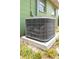 Carrier AC unit set on a concrete pad with green siding and windows in the background at 400 6Th Ne St, Fort Meade, FL 33841