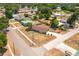 Aerial view of a neighborhood showcasing a single-story home with a brown roof at 400 6Th Ne St, Fort Meade, FL 33841