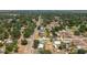 An aerial view shows the property's location surrounded by lush trees and neighborhood streets at 400 6Th Ne St, Fort Meade, FL 33841