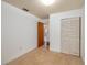 Bright bedroom with neutral carpet, an open closet, and a door leading to another room at 400 6Th Ne St, Fort Meade, FL 33841