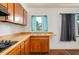 Kitchen featuring wood cabinets, laminate countertops, and a stainless steel sink at 400 6Th Ne St, Fort Meade, FL 33841