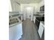 Bright kitchen featuring granite countertops, stainless steel appliances, and ample white cabinets at 4058 Oak Loop # 99, Mulberry, FL 33860