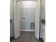 Convenient laundry room with white folding doors and easy access to kitchen and nearby rooms at 4058 Oak Loop # 99, Mulberry, FL 33860