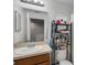 Bathroom features a single sink vanity and a shelf for storage at 4078 Winding Vine Dr, Lakeland, FL 33812