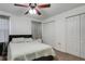 Bright bedroom features a ceiling fan and closet, offering storage space at 4078 Winding Vine Dr, Lakeland, FL 33812