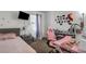 This cozy bedroom features stylish decor, neutral carpeting, and a large mirror at 4078 Winding Vine Dr, Lakeland, FL 33812
